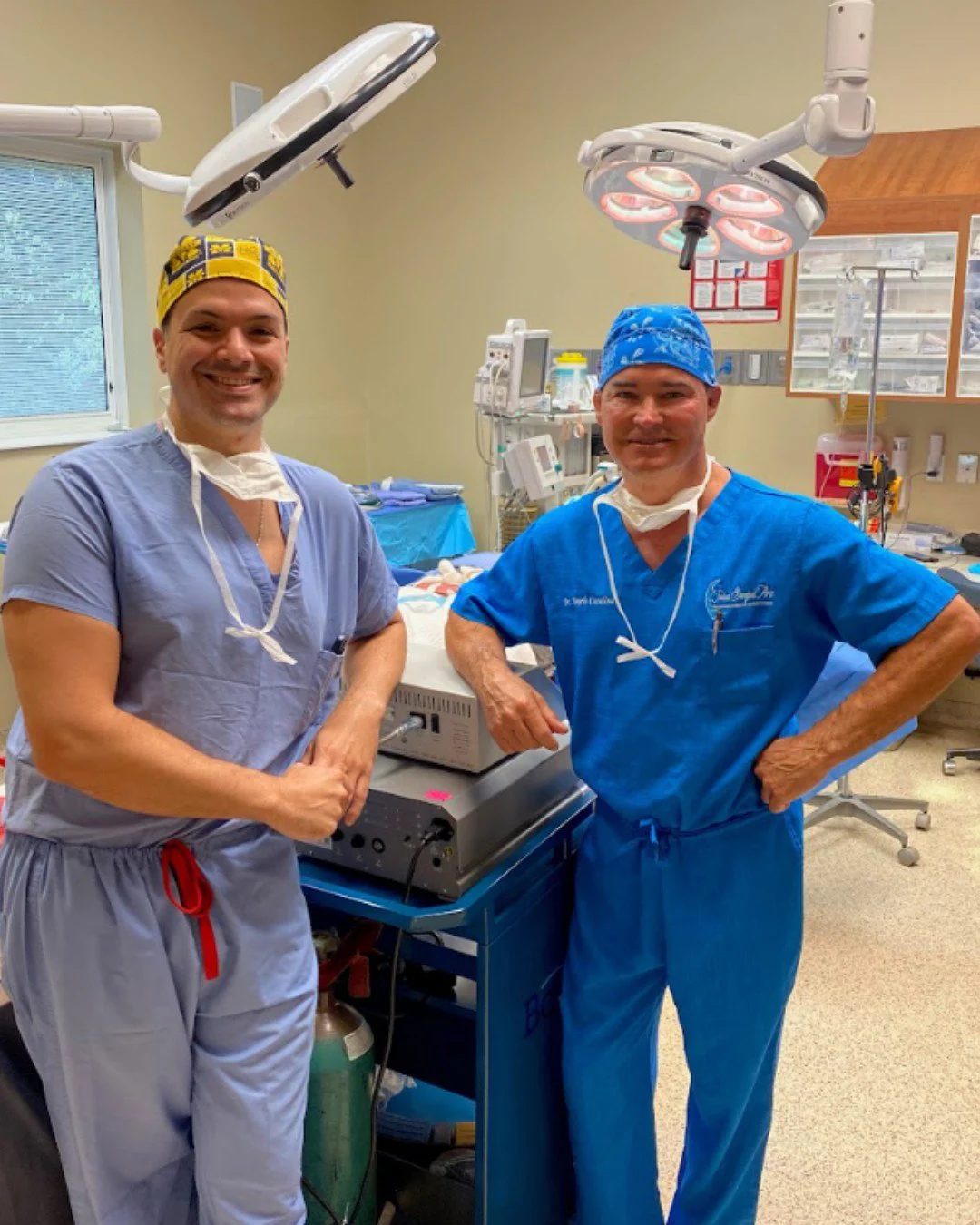 Dr. Angelo Cuzalina and Dr. Pasquale Tolomeo standing with each other in an operation theatre.